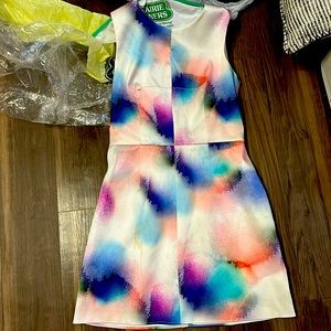 Worn once and dry cleaned, has small stain that does come out